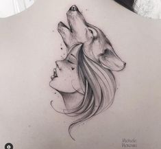 the back of a woman's shoulder with two wolfs on her left side