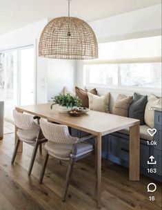 a dining room table with chairs and a bench