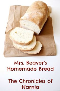 a loaf of bread sitting on top of a brown paper bag next to slices of bread