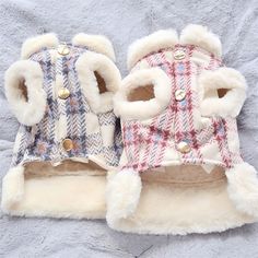 two dog coats with fur lined up on top of each other, one in plaid and the other in white