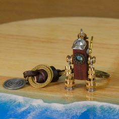 This unique steampunk wooden robot keychain is handcrafted with meticulous attention to detail. Made from high-quality wood and adorned with metal gears, this charming keychain is perfect as a thoughtful gift. The robot's hands and steampunk design make it a delightful accessory for anyone who loves unique and handmade items. Dimensions: - Height: 5 cm - Width: 2 cm - Depth: 1.5 cm Features: - Handmade from premium wood - Steampunk design with metal gear embellishments - Knitted hand grip for ad Robot Keychain, Wooden Robot, Metal Gears, Robot Hand, West Covina, Steampunk Design, Metal Gear, Keychains, Thoughtful Gifts