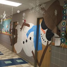 a hallway decorated with snowmen and christmas decorations