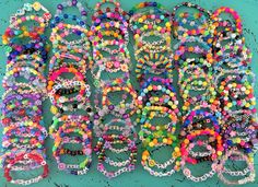 Festival Kandi bracelets. A great way to spread love, peace and kindness. Swap them with strangers or BFF's. Perfect for festivals, music concerts, friends, parties, party favors, band, birthday celebrations just about anywhere you go!! These are made with stretch elastic and a variety of beads. Some include plastic pony beads, faceted beads, sparkle beads just a variety of all kinds of beads!  They are all one of a kind! Each bracelet has a fun word or words. I try to keep the words family friendly! These are a random lot of how ever many you choose. You can choose the size with the checkout menu.  Small is about 5-6 inches. Medium is about 6-7 inches. Large is about 7-8 inches. If you are not sure about size, you can take a tape measure around your wrist.  Again, these are stretch so the