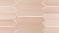 a white and pink tile wall with hexagonal tiles