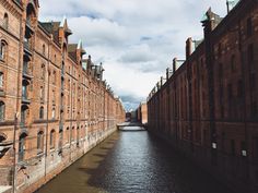 a canal running between two buildings next to each other