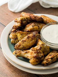 chicken wings with ranch dressing on a plate