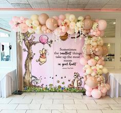 balloon arch with winnie the pooh quote