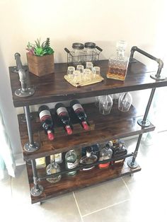 a wine rack with bottles and glasses on it