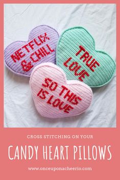 three crocheted hearts with the words, cross stitching on your candy heart pillows