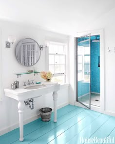 an instagram page with a blue floor and white sink in the center, and a mirror above it that says instagram