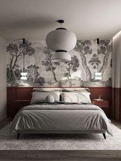 a large bed sitting in a bedroom next to a wall with trees on the walls