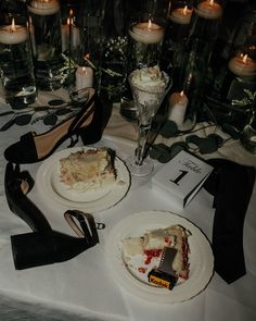 the table is set with two pieces of cake and high heels