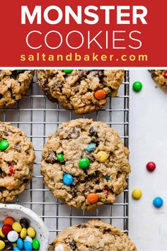 monster cookies on a cooling rack with m & m candy in the middle and text overlay