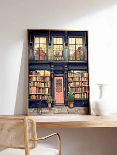 a table with a chair and a vase on it in front of a bookshelf