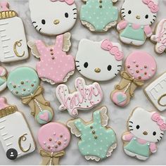 hello kitty baby shower cookies on a table