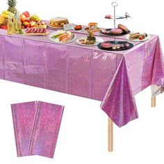 a table covered in purple sequins with food on it