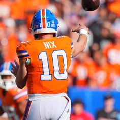 a football player throwing a ball during a game