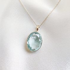 This stunning pendant is set in 14k Solid Yellow Gold with Natural Aquamarine with utmost precision. It is an unique gemstone Pendant for nearly every occasion and is completely hassle-free jewelry. ITEM DETAILS: * Gem: Aquamarine * Gem Size: 15X20mm * Gem Shape: Oval cut * Gem Weight: 12.17 carats * Gold Purity: 14KT * Gold Weight: 0.48 gram * Total Weight of the Pendant: 2.91 gram The Gold purity is guaranteed and it comes with authentic 14KT gold hallmark. Since my items are handmade, they are absolutely nickel and lead free. CUSTOMIZATION: * Gemstone customization is available and it can be substituted with a gem of your choice. Kindly message me for the same. PACKAGING * The Pendant comes with layers of safe and secure wrapping along with Free handmade jewelry box with every purchase. White Gold Aquamarine Gemstone Necklace, Elegant Aquamarine Jewelry For May Birthstone, Oval Aquamarine Gemstone Necklace, Aquamarine Necklace For Anniversary, White Gold Aquamarine Necklace Gift, Aquamarine Necklace In White Gold For Gift, White Gold Aquamarine Necklace For Gift, Sapphire Pendant Gemstone For Anniversary, Anniversary Aquamarine Gemstone Necklace