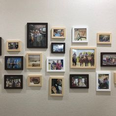 a wall that has many pictures on it