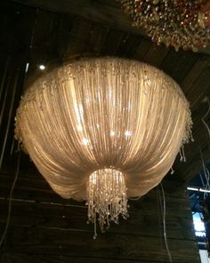 a chandelier hanging from the ceiling in a room