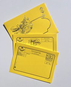 two yellow envelopes sitting on top of each other