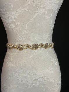 Wedding Belt, Bridal Belt, Sash Belt, Crystal Pearl Rhinestone, Cream Ribbon, Gold Base Rhinestones, Ivory ribbon Absolutely Dazzling Finest Crystal Rhinestone.  This belt will take your breath away!  ** Total sash belt is measuring 2.5 yards long (88 inches). Gold Embellished Wedding Sash, Gold Embellished Sashes For Wedding, Elegant Bedazzled Wedding Sash, Bedazzled Crystal Bridal Belt For Wedding, Crystal Bedazzled Bridal Belt For Wedding, Bedazzled White Bridal Belt For Wedding, White Crystal Wedding Sash, Gold Crystal Bridal Belt For Wedding, Fitted Gold Sash For Wedding