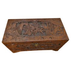 an old wooden box with carvings on it