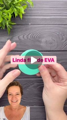 two hands holding up a green and pink business card with the words linda fi de eva