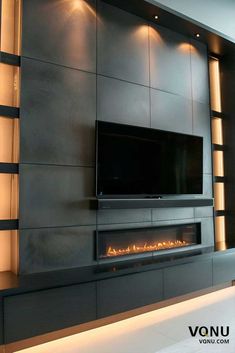 modern fireplace with built - in tv and led lighting