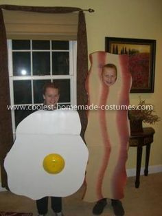 a man standing next to a giant fried egg costume