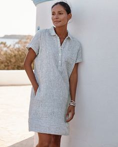 An essential shirtdress that's ready for summer in our breezy linen. The partial button placket gives it a slightly sportier look that complements the polished popover silhouette beautifully.  Exclusive. Partial button placket. Short sleeves with fixed rolled cuffs. Chest and side-seam pockets. Banded hem. Summer Outfits 50 And Older, Casual Dresses For Older Women, Resort Wear For Women Over 60, Shirtdress Outfit, Summer Dresses With Sleeves, 70 Year Old Women, Dresses For Apple Shape, Pinterest Wardrobe, Dressing Over 50