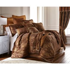 the comforter is made up in brown and gold colors