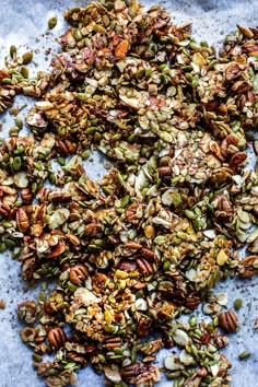 an assortment of nuts and seeds on a table