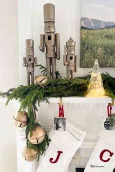 christmas stockings hanging from a mantel decorated with holiday decorations and nutcrackers