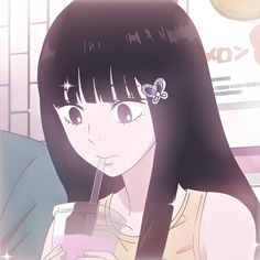 a girl with long black hair holding a drink