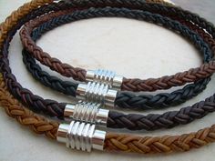 This thick masculine leather necklace with stainless steel magnetic clasp makes the the perfect gift. This necklace style features thick 8mm Premium Quality Braided Leather Cord. This unique cord is made by braiding 8 individual strands of leather. A rugged industrial styled stainless steel magnetic clasp serves as a visual center piece. (22 mm 3/4 inch in length 14mm wide 1/2 inch) Available in: Natural Light Brown, Natural Medium Brown, Natural Dark Brown, Natural Black Be sure to check out th Mens Leather Necklace, Braided Leather Necklace, Triple Wrap Bracelet, Leather Bracelets Women, Necklace Mens, Mens Necklace, Braided Necklace, Red Bracelets, Braided Leather Bracelet