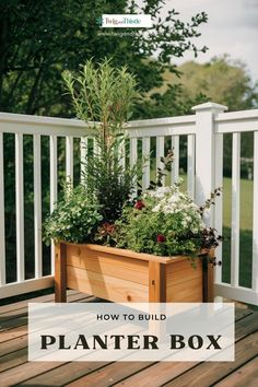 a wooden planter box filled with plants on top of a deck