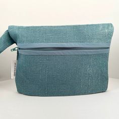 "This beautiful wristlet bag is great for evening out, a wedding, special occasion, church, prom or even if you like to be fancy when you're out running errands! Plenty of room for your essentials - keys, wallet, phone, mask, sunglasses, lipstick & compact. This small wrist handbag is made from a pretty teal fabric with a coordinating teal shimmer fabric lining. It's easily worn on your wrist or forearm. Your back and shoulders will thank you. Dimensions are approximately 8.5\" x 5.5\" (not Phone Mask, Red Satin Fabric, Mask Sunglasses, Shimmer Fabric, Crushed Velvet Fabric, Everyday Handbag, Wristlet Bag, Teal Fabric, Wristlet Purse