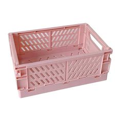 a pink plastic crate sitting on top of a white surface