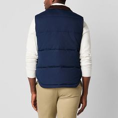 Layer up in style for cold-weather outings with this St. John's Bay men's quilted cargo puffer vest. Made from a warm material and lining, this midweight style has two front snap pockets and a full zip closure. Wear it over a sweater with jeans.Closure Type: ZipperPockets: 2 Front Snap PocketsWarmth Factor: MidweightApparel Length: 27 InchesOuterwear Length: ShortFiber Content: 100% PolyesterFabric Description: WovenFilling Content: 100% PolyesterLining: LinedLining Material: PolyesterCare: Mac… Sleeveless Cotton Puffer Outerwear, Navy Sleeveless Vest For Winter, Winter Cotton Vest With Padded Collar, Quilted Down Sleeveless Outerwear, Casual Vest With Padded Collar For Cold Weather, Blue Winter Vest For Outdoor Activities, Blue Vest For Outdoor Winter Activities, Navy Sleeveless Outerwear With Pockets, Navy Puffer Outerwear For Cold Weather