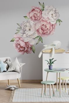 a living room with flowers painted on the wall