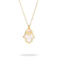 Harness the power of protection and luck with the Pearl Divine Hamsa & Evil Eye Pendant Gold Vermeil Chain Necklace. This elegant pendant, crafted from 18k gold-plated sterling silver, features a pearl Hamsa hand design with a gold evil eye symbol nestled inside. Designed to not only elevate your style but also provide spiritual protection and good fortune, this necklace is the perfect blend of chic and meaningful. Paired with a gold vermeil chain, it brings the power of these ancient symbols into your everyday look. Details 18K gold plated on sterling silver Pearl Necklace length 20" with pendant and 2'' extender Pendant height 0. 8'' Pendant width 0. 6'' Avoid contact with chemicals, makeup, parfume. Do not use dips or abrasive cleaners on necklace. To clean and brighten it up your neckl Spiritual Yellow Gold-plated Necklaces, Spiritual Yellow Gold Plated Necklaces, Spiritual Yellow Gold Pendant Necklace, Yellow Gold Plated Spiritual Necklace, Spiritual Yellow Gold Tarnish-resistant Necklace, Yellow Gold Evil Eye Spiritual Necklace, Spiritual Yellow Gold Necklace With Evil Eye, Symbolic Yellow Gold Evil Eye Necklace, Spiritual Yellow Gold Evil Eye Necklace