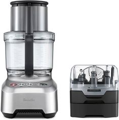 a silver blender sitting on top of a counter next to a black and silver container