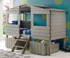 a child's bedroom with bunk beds and storage bins