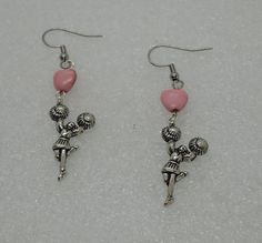 Cheerleader earrings..pink stone hearts, hypoallergenic stainless steel, lead and nickel free. Your choice of hook, post or leverback at checkout. Will arrive in a gift box. Pink Novelty Dangle Jewelry, Novelty Pink Metal Jewelry, Pink Metal Novelty Jewelry, Novelty Personalized Pink Earrings, Pink Hypoallergenic Dangle Heart Earrings, Personalized Pink Novelty Earrings, Novelty Pink Hypoallergenic Earrings, Adjustable Pink Earrings For Valentine's Day, Pink Adjustable Earrings For Valentine's Day