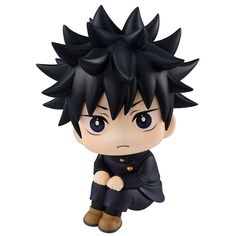 an anime figurine with black hair and blue eyes, sitting on the ground