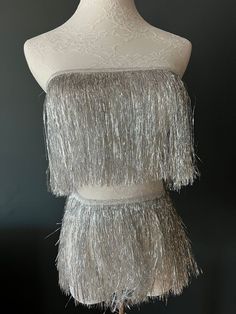 Fantastic 8" fringe with a 1cm tape for sewing. Very High quality.  Colour: Silver  Perfect for dresses, tops, dance costumes, party wear, crafting.  Available in 15 Colours.  see separate listings for colour photos.  Price Per metre (100cm / 39inches) Visit www.haberdasheryfan.com for our full range with free shipping. More unique pieces added daily! Follow us on instagram @haberdasheryfan Fringe Clothing, Fringe Fabric, Party Kleidung, Suede Fringe, Silver Accessories, Dance Costume, Tassel Fringe, Silver Sequin, Silver Foil