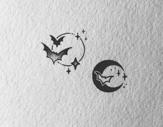 two bats flying over the moon and stars on a white paper background with space for text