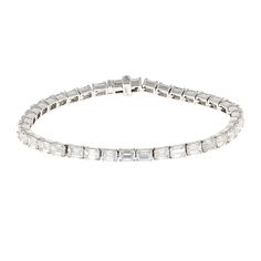 This IDC Signature Collection is as elegant as it is opulent. Taking a timeless classic, Emerald Cut Diamonds, and placing them in a East West orientation, gives this tennis bracelet a contemporary aesthetic. With 9.52 CTW, each Diamond is set in a four prong 14k White Gold setting to further allow the brilliance of the diamonds to sparkle. Color/Clarity: HI/VS White Gold Set, Diamond Tennis Bracelet, Emerald Cut Diamond, Contemporary Aesthetic, Tennis Bracelet Diamond, Emerald Cut Diamonds, East West, Signature Collection, Tennis Bracelet