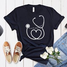 ABOUT OUR Nurse Stethoscope Shirt, Custom Nurse Shirt, Nurse Shirt, Nursing School Tee, Nurse Loyal Hello everyone! Welcome to Ricardo Zarate store. Here, you'll find a wide selection of affordable, high-quality personalized designs and unique creations perfect for your friends, family, coworkers, and loved ones. Our prints are created using the latest technological materials, ensuring exceptional quality. Each order is meticulously prepared using top-quality inks during the production process. White Casual Nursing Shirt, Nursing Graphic Tee Cotton Top, Casual White Nursing Tops, Cotton Graphic Print Tops For Nursing, Cotton Graphic Print Nursing Shirt, Cotton Graphic Print Nursing Tops, Cotton Short Sleeve Nursing Shirt, Cotton Short Sleeve Nursing Tops, Short Sleeve Cotton Nursing Tops